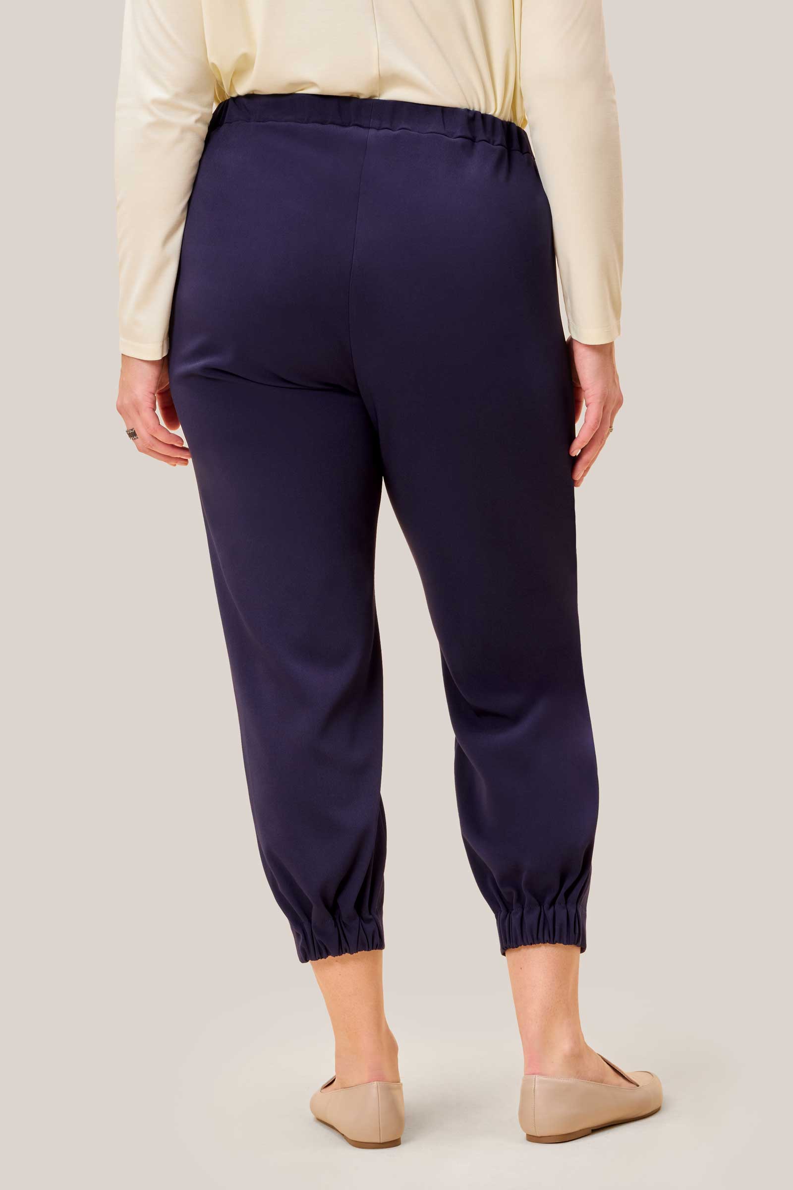 Back view showing elasticated waistband and gathered hem detail