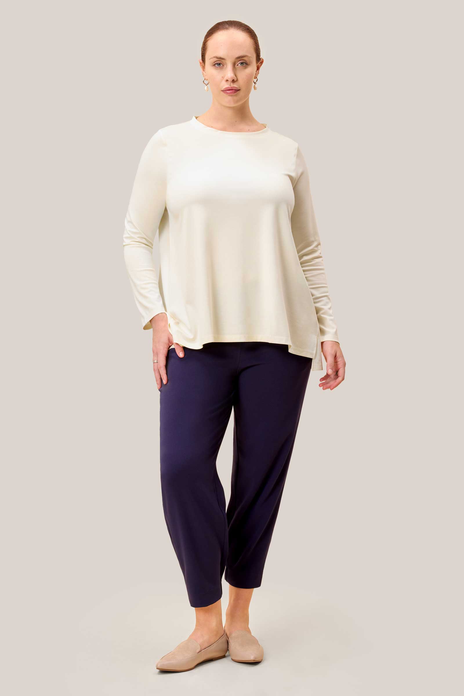 Front view of model wearing Smart Navy Joggers with long sleeve top THE HOUR