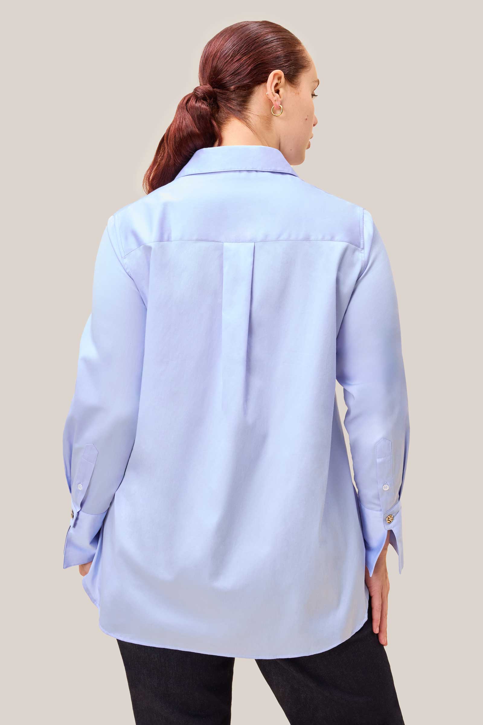 Back view of powder blue cotton sateen shirt – longline silhouette designed for fuller figures. THE HOUR