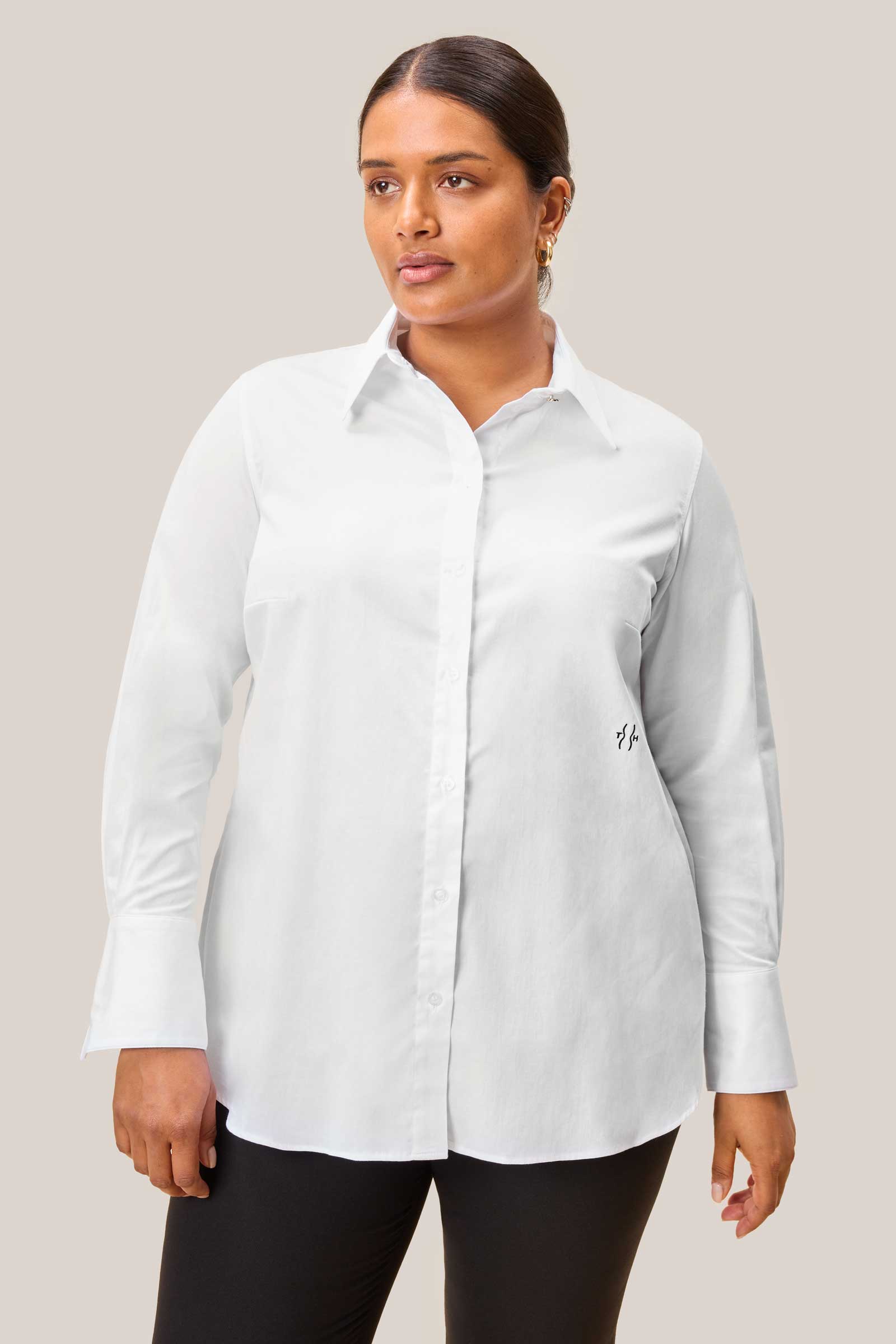 Plus size model wearing white satin cotton shirt with gold collar buttons – front view, designed by The Hour