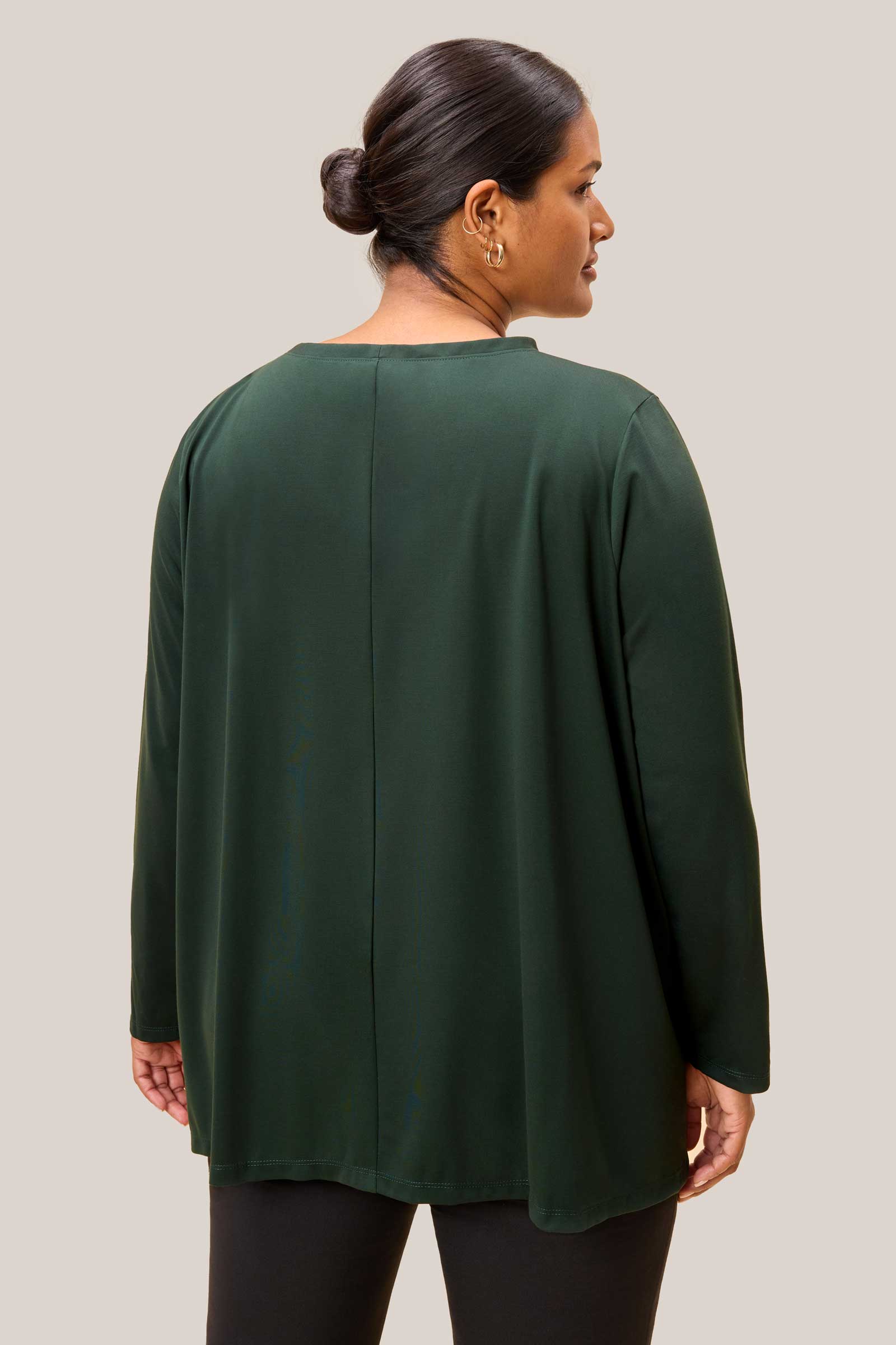 Back view of olive green plus size top showing fluid drape and seam detail.