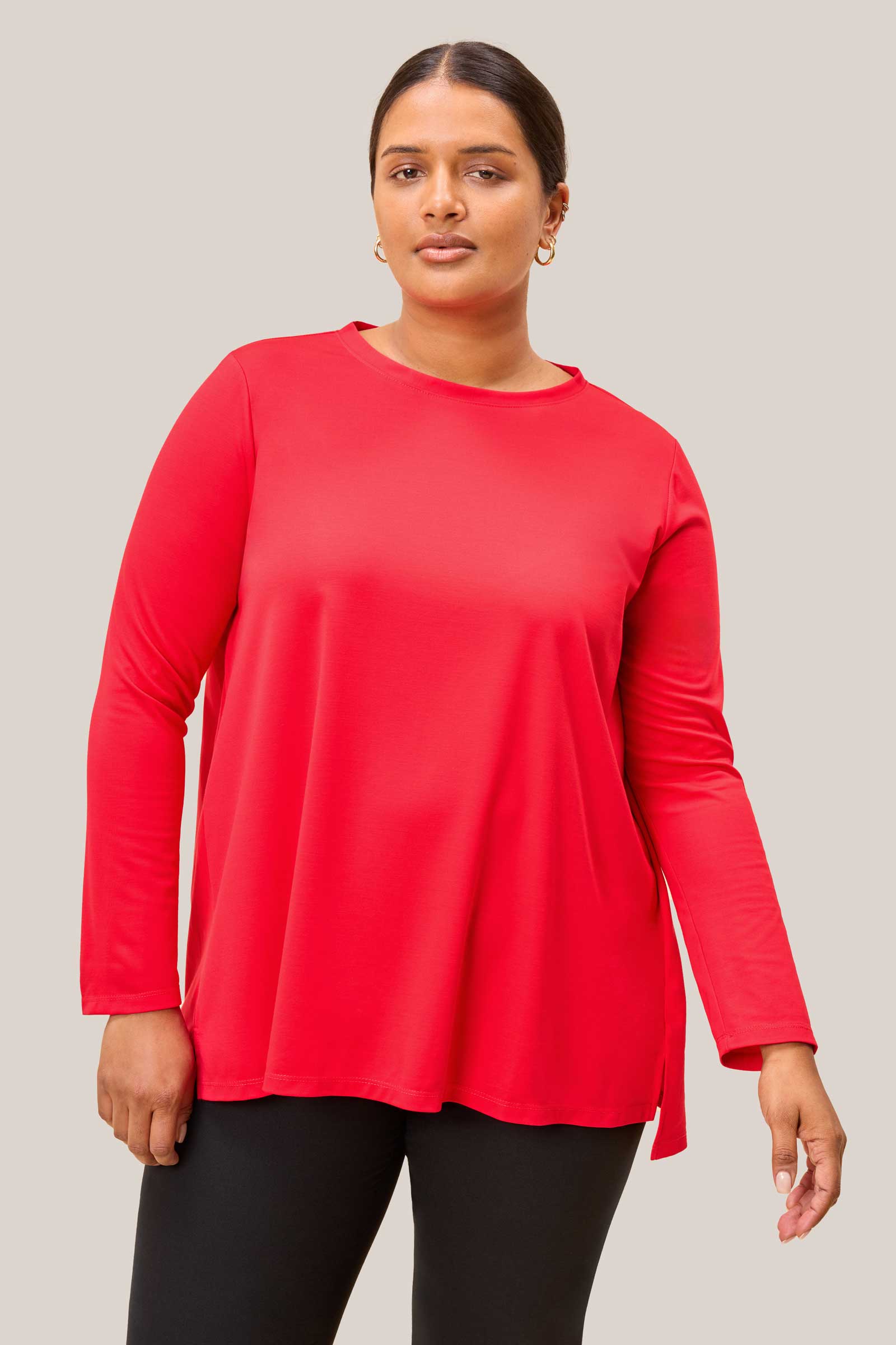 Plus size model wearing red jersey top
