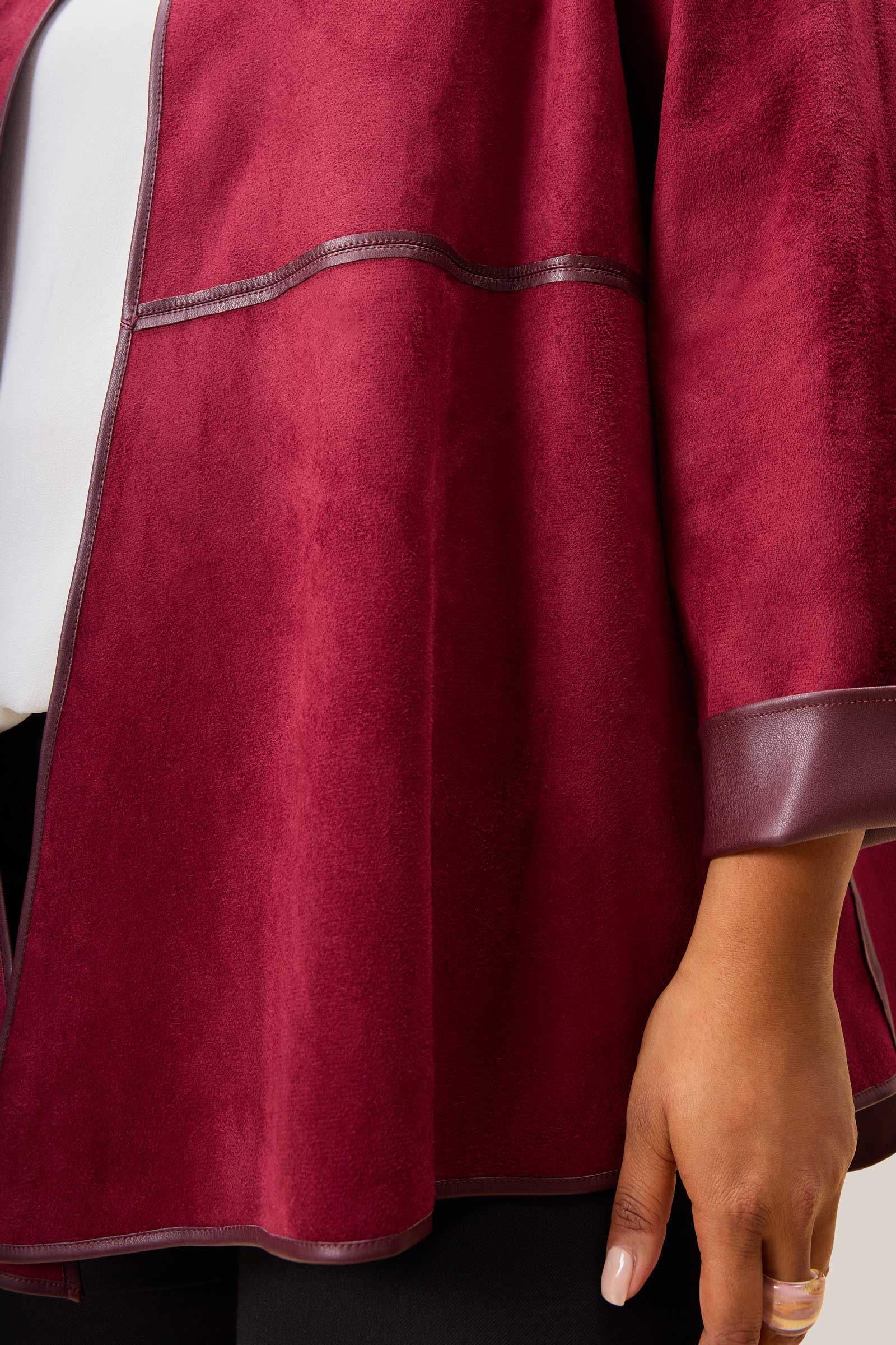 Close-up of a maroon suede jacket