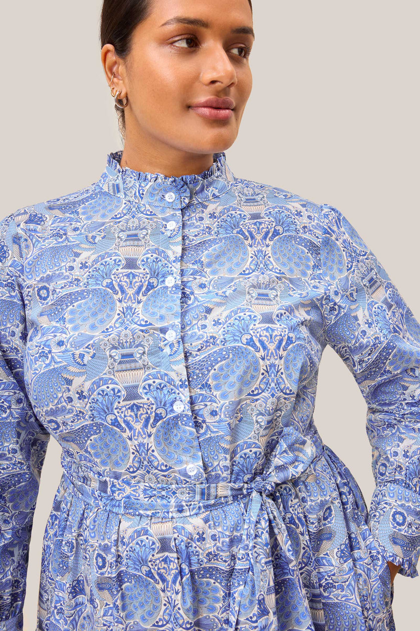 Close-up of ruffled collar and button detailing on blue THE HOUR x Liberty print plus size dress