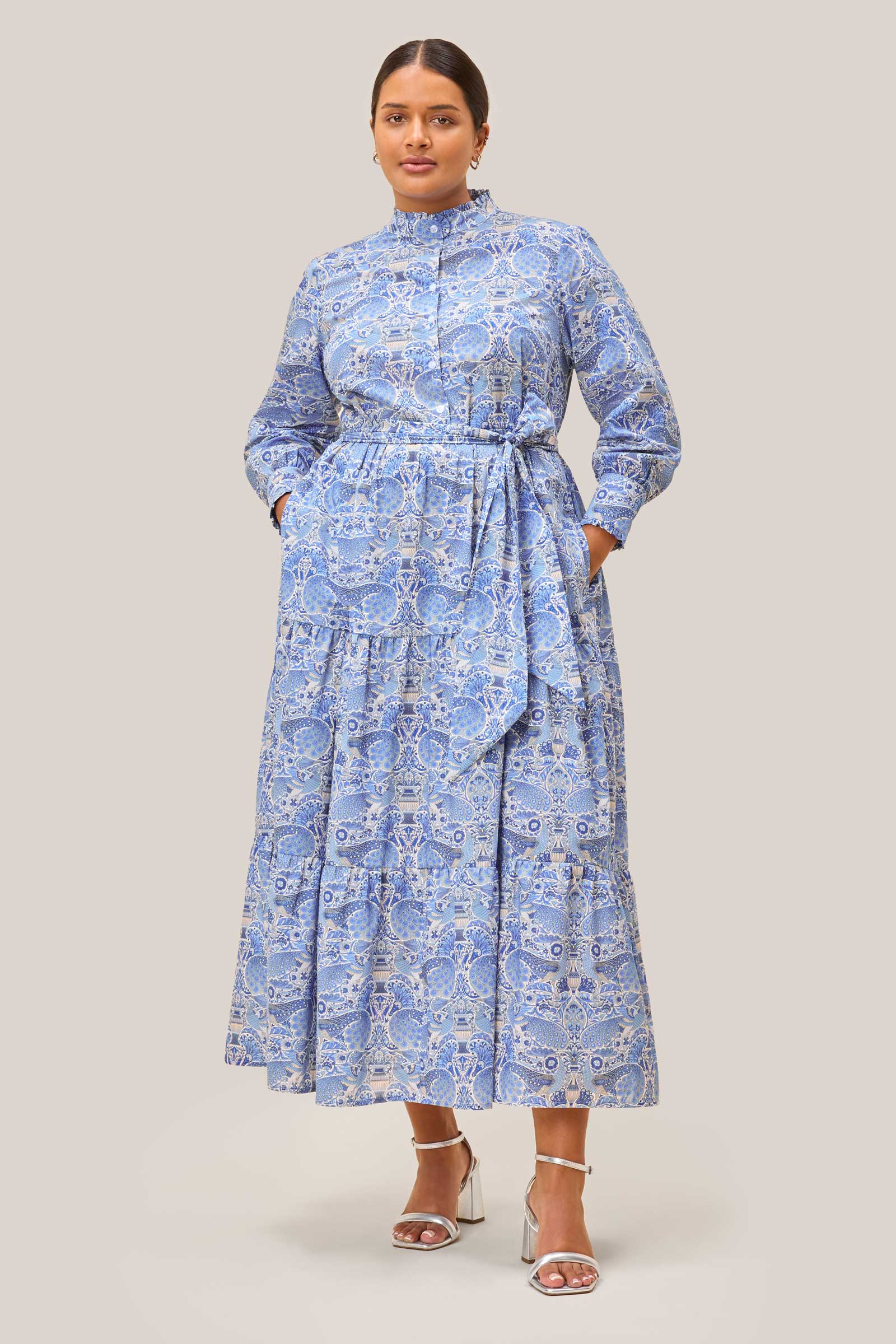 Frontal pose showing entire silhouette of blue Liberty print maxi dress with tie waist
Plus size THE HOUR