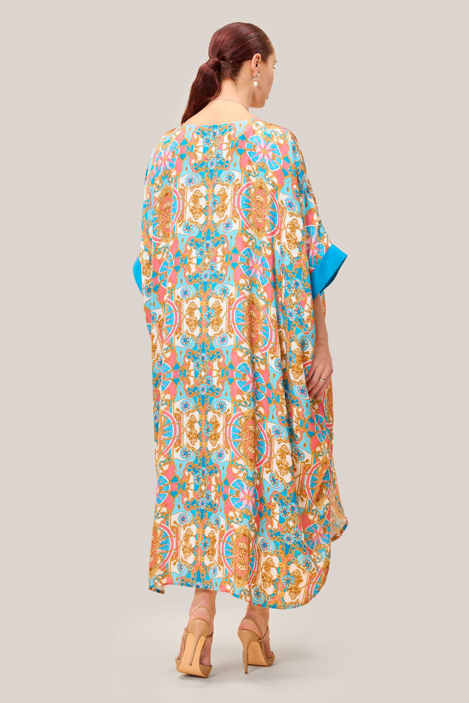 Printed satin kaftan worn loose, showing fluid silhouette and sleeve detail. THE HOUR | PLUSSIZE