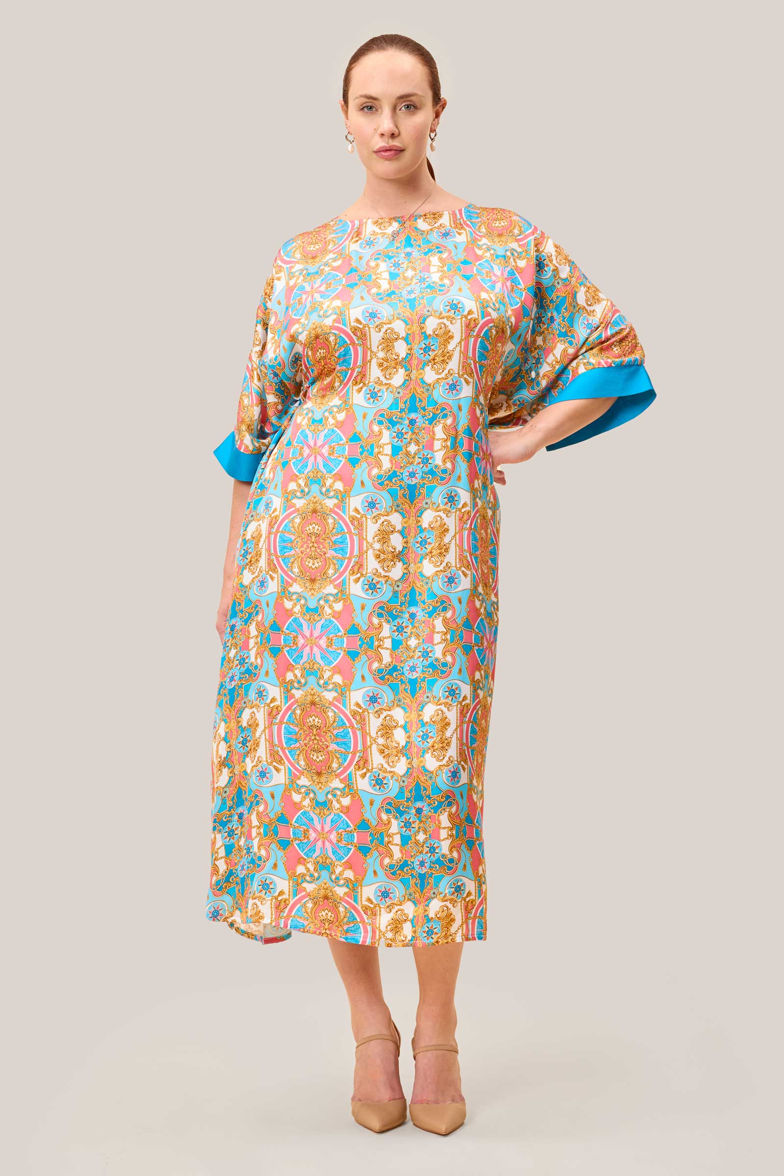 Curvy Model wearing printed satin kaftan belted at the back. THE HOUR