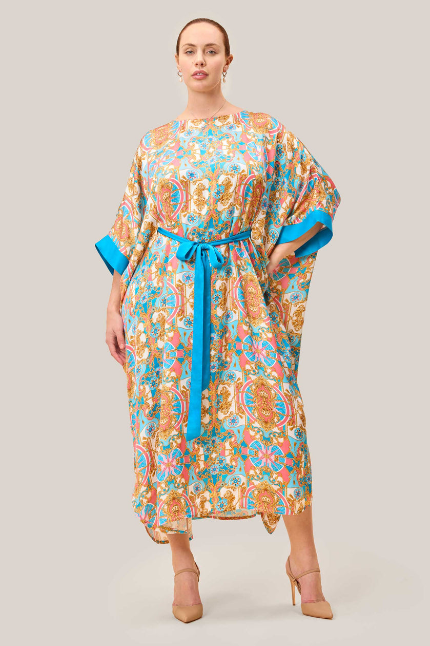 Front view of plus size baroque printed kaftan dress with belt for defined waist. THE HOUR