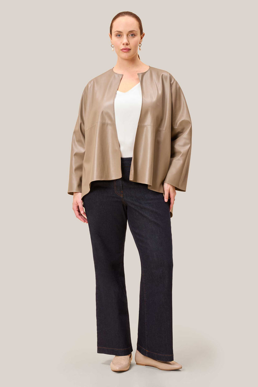 Model is wearing vegan leather reversible jacket, plussize
