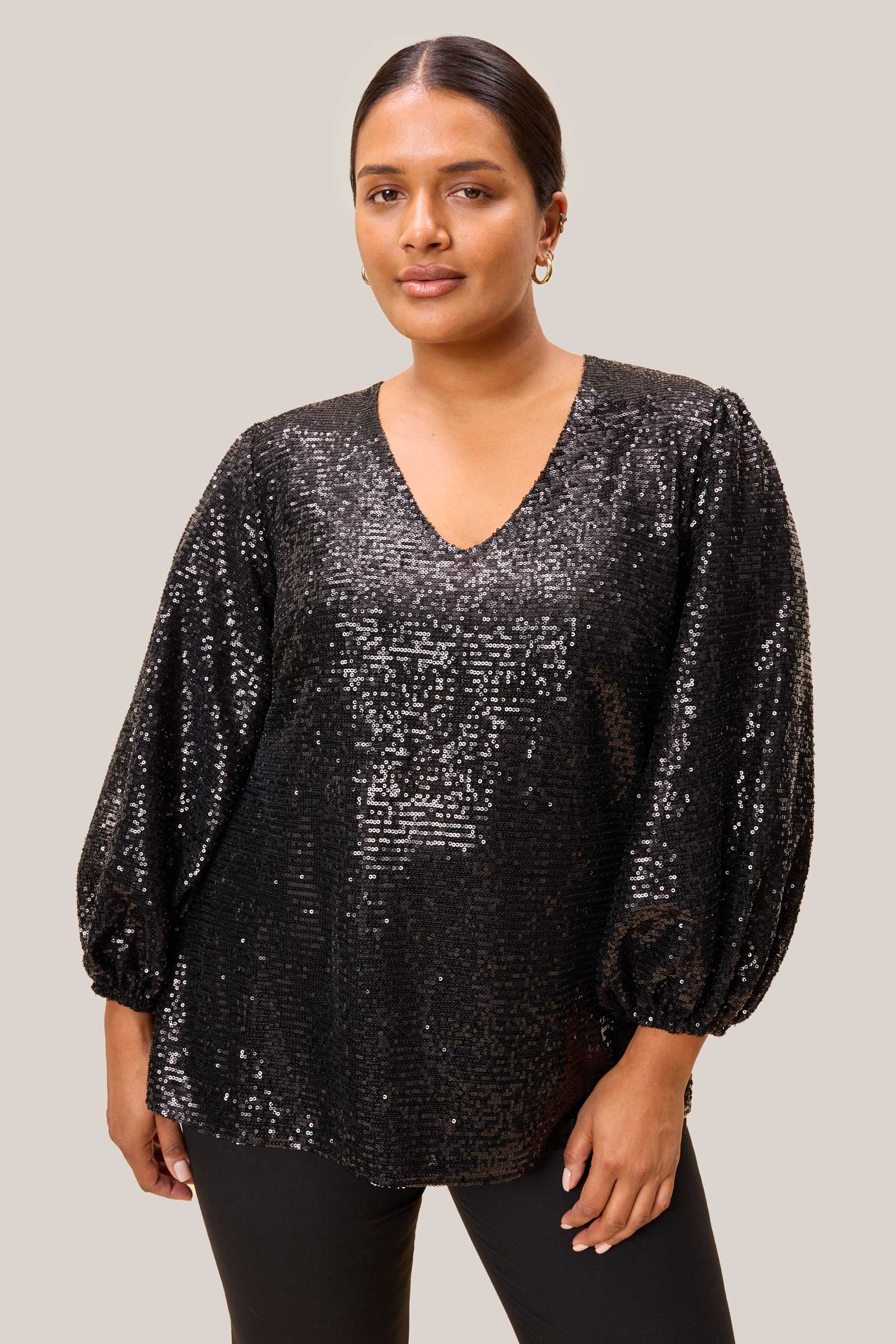 Shimmering black sequins and gathered cuff on a plus-size party blouse by The Hour.