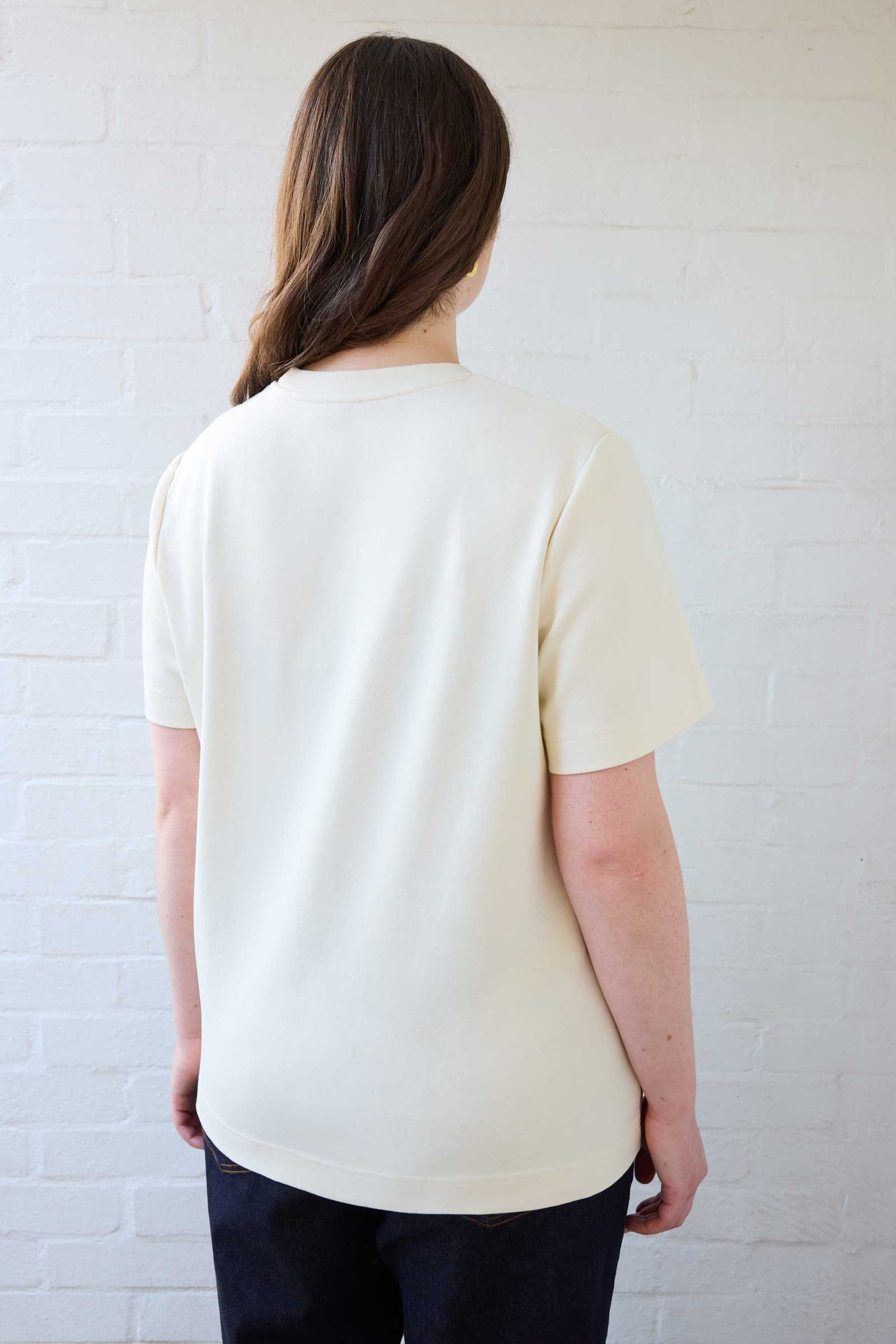 Back view of plus size organic cotton T-shirt in cream, designed for curves by The Hour
