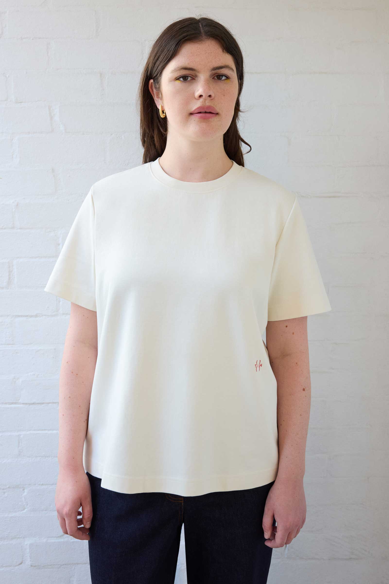 Model wearing cream plus size organic cotton T-shirt styled with dark denim jeans by The Hour